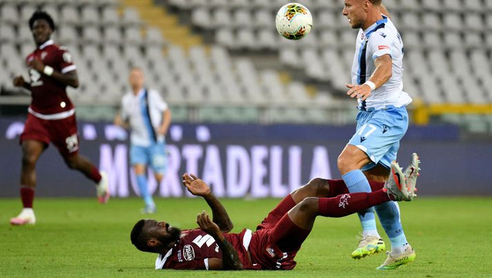 TURIN, ITALY - JUNE 30: Ciro Immobile of SS Lazio compete for the ball with Nicola Nkoulou of Torino FC during the Serie A match between Torino FC and  SS Lazio at Stadio Olimpico di Torino on June 30, 2020 in Turin, Italy. (Photo by Marco Rosi - SS Lazio/Getty Images) 