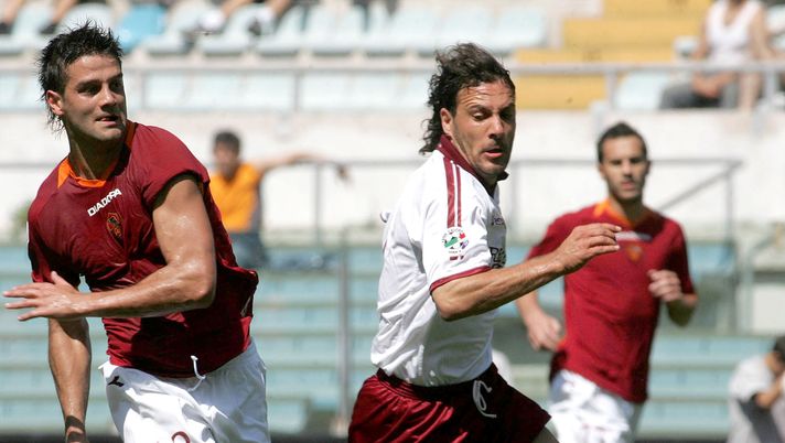 ROME, ITALY - MAY 13:  Cristian Chivu of Roma runs on the ball past Roberto Muzzi of Torino during the Serie A match between Roma and Torino at the Stadio Olimpico, on May 13, 2007 in Rome Italy. (Photo by Newpress/Getty Images) 