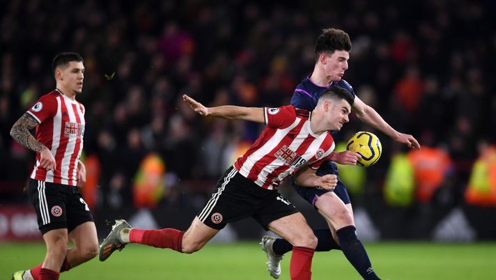 SHEFFIELD, ENGLAND - JANUARY 10: Declan Rice of West Ham United battles for possession with John Egan of Sheffield United as Declan Rice hand balls which leads to Robert Snodgrass of West Ham United (not pictured) goal being disallowed by VAR during the Premier League match between Sheffield United and West Ham United at Bramall Lane on January 10, 2020 in Sheffield, United Kingdom. (Photo by Laurence Griffiths/Getty Images) SHEFFIELD, ENGLAND - JANUARY 10: Declan Rice of West Ham United battles for possession with John Egan of Sheffield United as Declan Rice hand balls which leads to Robert Snodgrass of West Ham United (not pictured) goal being disallowed by VAR during the Premier League match between Sheffield United and West Ham United at Bramall Lane on January 10, 2020 in Sheffield, United Kingdom. (Photo by Laurence Griffiths/Getty Images)