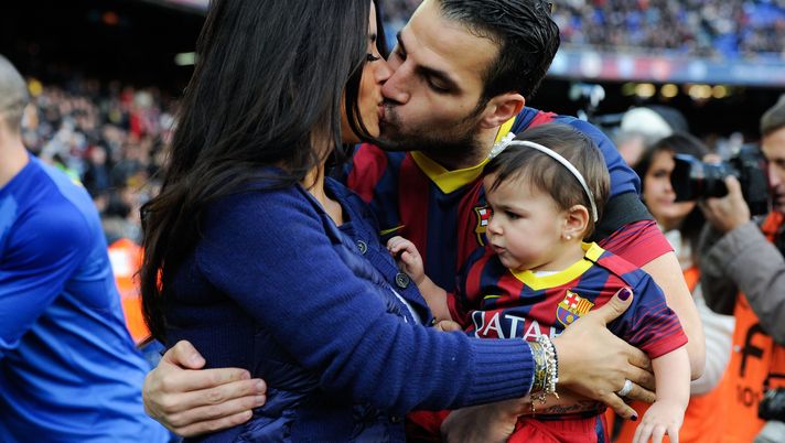BARCELONA, SPAIN - JANUARY 05:  Cesc Fabregas of FC Barcelona kisses his girlfriend Daniella Semaan as he holds his daughter Lia during the La Liga match between FC Barcelona and Elche FC at Camp Nou on January 5, 2014 in Barcelona, Spain.  (Photo by David Ramos/Getty Images) 