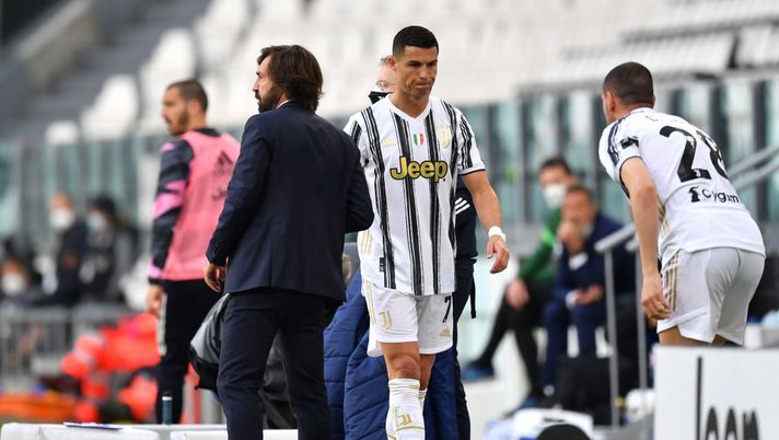 TURIN, ITALY - MAY 15: Andrea Pirlo, Head Coach of Juventus interacts with Cristiano Ronaldo of Juventus after he is substituted during the Serie A match between Juventus and FC Internazionale at Allianz Stadium on May 15, 2021 in Turin, Italy. Sporting stadiums around Italy remain under strict restrictions due to the Coronavirus Pandemic as Government social distancing laws prohibit fans inside venues resulting in games being played behind closed doors. (Photo by Valerio Pennicino/Getty Images) TURIN, ITALY - MAY 15: Andrea Pirlo, Head Coach of Juventus interacts with Cristiano Ronaldo of Juventus after he is substituted during the Serie A match between Juventus and FC Internazionale at Allianz Stadium on May 15, 2021 in Turin, Italy. Sporting stadiums around Italy remain under strict restrictions due to the Coronavirus Pandemic as Government social distancing laws prohibit fans inside venues resulting in games being played behind closed doors. (Photo by Valerio Pennicino/Getty Images)