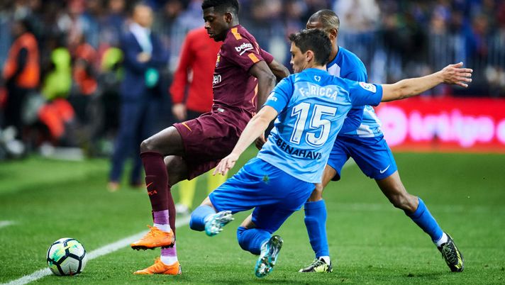 MALAGA, SPAIN - MARCH 10:  Ousmane Dembele of FC Barcelona duels for the ball with Federico Ricca of Malaga during the La Liga match between Malaga and Barcelona at Estadio La Rosaleda on March 10, 2018 in Malaga, spain.  (Photo by Aitor Alcalde/Getty Images) 