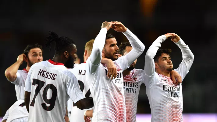 TURIN, ITALY - MAY 12: Theo Hernandez of A.C. Milan celebrates with team mates after scoring their side's first goal during the Serie A match between Torino FC  and AC Milan at Stadio Olimpico di Torino on May 12, 2021 in Turin, Italy. Sporting stadiums around Italy remain under strict restrictions due to the Coronavirus Pandemic as Government social distancing laws prohibit fans inside venues resulting in games being played behind closed doors. (Photo by Valerio Pennicino/Getty Images)