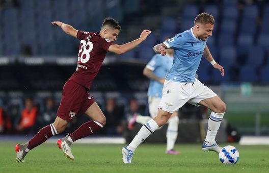 ROME, ITALY - APRIL 16: Samuele Ricci of Torino marks Ciro Immobile of Lazio during the Serie A match between SS Lazio and Torino FC at Stadio Olimpico on April 16, 2022 in Rome, Italy. (Photo by Paolo Bruno/Getty Images)