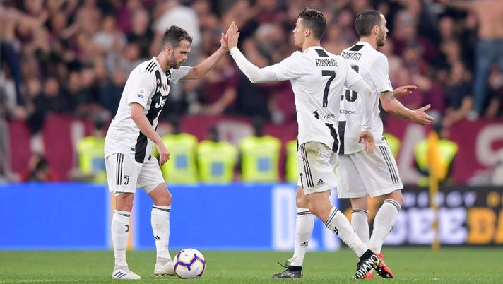 TURIN, ITALY - MAY 03: Cristiano Ronaldo of Juventus celebrates his goal of 1-1 with teammate Miralem Pjanic during the Serie A match between Juventus and Torino FC on May 3, 2019 in Turin, Italy.  (Photo by Daniele Badolato - Juventus FC/Juventus FC via Getty Images) 