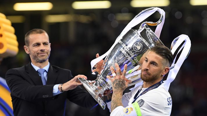 CARDIFF, WALES - JUNE 03:  Sergio Ramos of Real Madrid collects the trophy from UEFA President Aleksander Ceferin after the UEFA Champions League Final  