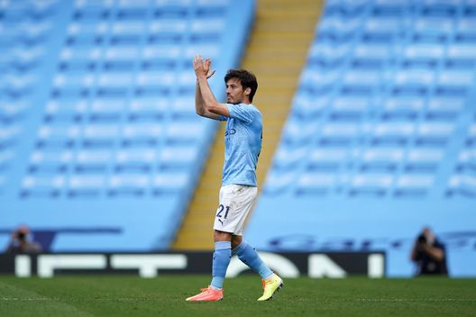MANCHESTER, ENGLAND - JULY 26: David Silva of Manchester City applauds as he is substituted during the Premier League match between Manchester City and Norwich City at Etihad Stadium on July 26, 2020 in Manchester, England.Football Stadiums around Europe remain empty due to the Coronavirus Pandemic as Government social distancing laws prohibit fans inside venues resulting in all fixtures being played behind closed doors. (Photo by Dave Thompson/Pool via Getty Images) MANCHESTER, ENGLAND - JULY 26: David Silva of Manchester City applauds as he is substituted during the Premier League match between Manchester City and Norwich City at Etihad Stadium on July 26, 2020 in Manchester, England.Football Stadiums around Europe remain empty due to the Coronavirus Pandemic as Government social distancing laws prohibit fans inside venues resulting in all fixtures being played behind closed doors. (Photo by Dave Thompson/Pool via Getty Images)