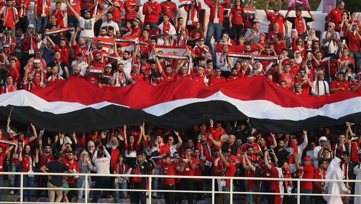 AL AIN, UNITED ARAB EMIRATES - JANUARY 15: The Syria supporters in full voice during the AFC Asian Cup Group B match between Australia and Syria at Khalifa Bin Zayed Stadium on January 15, 2019 in Al Ain, United Arab Emirates. (Photo by Francois Nel/Getty Images) AL AIN, UNITED ARAB EMIRATES - JANUARY 15: The Syria supporters in full voice during the AFC Asian Cup Group B match between Australia and Syria at Khalifa Bin Zayed Stadium on January 15, 2019 in Al Ain, United Arab Emirates. (Photo by Francois Nel/Getty Images)