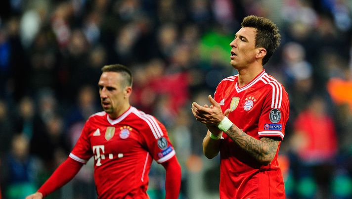 MUNICH, GERMANY - APRIL 09:  Franck Ribery (L) and Mario Mandzukic of Muenchen react after the UEFA Champions League quarter-final second leg match between FC Bayern Muenchen and Manchester United at Allianz Arena on April 9, 2014 in Munich, Germany.  (Photo by Lennart Preiss/Bongarts/Getty Images) 