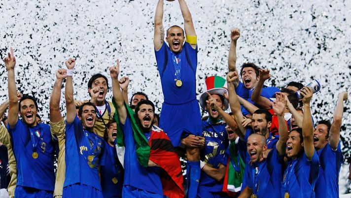 BERLIN - JULY 09: The Italian players celebrate as Fabio Cannavaro of Italy lifts the World Cup trophy aloft following victory in a penalty shootout at the end of the FIFA World Cup Germany 2006 Final match between Italy and France at the Olympic Stadium on July 9, 2006 in Berlin, Germany. (Photo by Shaun Botterill/Getty Images) BERLIN - JULY 09: The Italian players celebrate as Fabio Cannavaro of Italy lifts the World Cup trophy aloft following victory in a penalty shootout at the end of the FIFA World Cup Germany 2006 Final match between Italy and France at the Olympic Stadium on July 9, 2006 in Berlin, Germany. (Photo by Shaun Botterill/Getty Images)