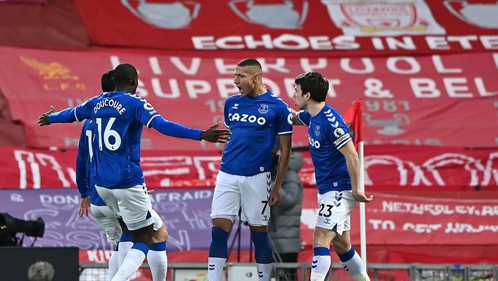 LIVERPOOL, ENGLAND - FEBRUARY 20: Richarlison of Everton celebrates with team mates Abdoulaye Doucoure and Seamus Coleman after scoring his team's first goal during the Premier League match between Liverpool and Everton at Anfield on February 20, 2021 in Liverpool, England. Sporting stadiums around the UK remain under strict restrictions due to the Coronavirus Pandemic as Government social distancing laws prohibit fans inside venues resulting in games being played behind closed doors. (Photo by Laurence Griffiths/Getty Images) LIVERPOOL, ENGLAND - FEBRUARY 20: Richarlison of Everton celebrates with team mates Abdoulaye Doucoure and Seamus Coleman after scoring his team's first goal during the Premier League match between Liverpool and Everton at Anfield on February 20, 2021 in Liverpool, England. Sporting stadiums around the UK remain under strict restrictions due to the Coronavirus Pandemic as Government social distancing laws prohibit fans inside venues resulting in games being played behind closed doors. (Photo by Laurence Griffiths/Getty Images)