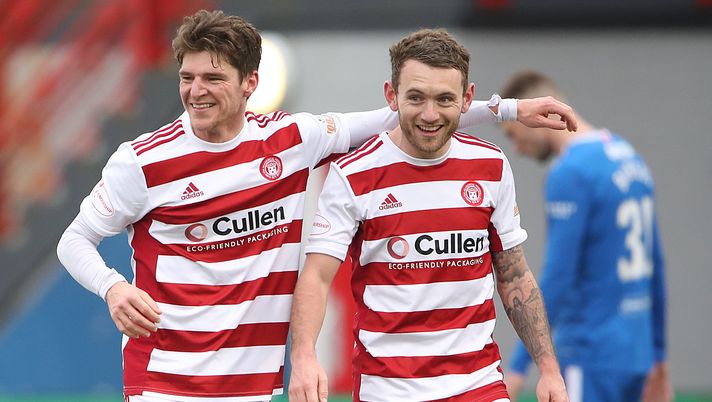 HAMILTON, SCOTLAND - FEBRUARY 07: Ross Callachan of Hamilton Academical celebrates with team mate Lee Hodson after scoring their side's equalizing goal during the Ladbrokes Scottish Premiership match between Hamilton Academical and Rangers at Hope CBD Stadium on February 07, 2021 in Hamilton, Scotland. Sporting stadiums around the UK remain under strict restrictions due to the Coronavirus Pandemic as Government social distancing laws prohibit fans inside venues resulting in games being played behind closed doors. (Photo by Ian MacNicol/Getty Images) HAMILTON, SCOTLAND - FEBRUARY 07: Ross Callachan of Hamilton Academical celebrates with team mate Lee Hodson after scoring their side's equalizing goal during the Ladbrokes Scottish Premiership match between Hamilton Academical and Rangers at Hope CBD Stadium on February 07, 2021 in Hamilton, Scotland. Sporting stadiums around the UK remain under strict restrictions due to the Coronavirus Pandemic as Government social distancing laws prohibit fans inside venues resulting in games being played behind closed doors. (Photo by Ian MacNicol/Getty Images)