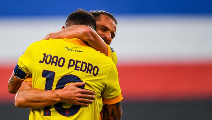GENOA, ITALY - MARCH 7: Joao Pedro of Cagliari (L) celebrates with his team-mate Leonardo Pavoletti after scoring a goal during the Serie A match between UC Sampdoria and Cagliari Calcio at Stadio Luigi Ferraris on March 7, 2021 in Genoa, Italy. (Photo by Paolo Rattini/Getty Images) GENOA, ITALY - MARCH 7: Joao Pedro of Cagliari (L) celebrates with his team-mate Leonardo Pavoletti after scoring a goal during the Serie A match between UC Sampdoria and Cagliari Calcio at Stadio Luigi Ferraris on March 7, 2021 in Genoa, Italy. (Photo by Paolo Rattini/Getty Images)