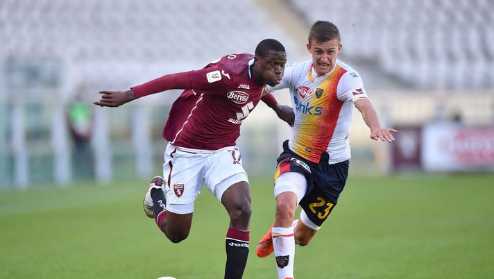 TURIN, ITALY - OCTOBER 28:  Wilfried Singo (L) of Torino FC is challenged by John Gunnar Bjorkengren of US Lecce during the Coppa Italia match between Torino FC and US Lecce at Stadio Olimpico Grande Torino on October 28, 2020 in Turin, Italy.  (Photo by Valerio Pennicino/Getty Images) 