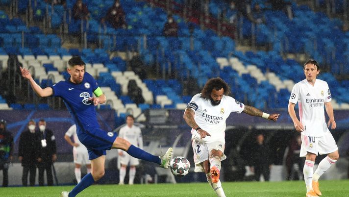 MADRID, SPAIN - APRIL 27 Marcelo of Real Madrid shoots and misses whilst under pressure from Jorginho of Chelsea during the UEFA Champions League Semi Final First Leg match between Real Madrid and Chelsea FC at Estadio Alfredo Di Stefano on April 27, 2021 in Madrid, Spain. Sporting stadiums around Spain remain under strict restrictions due to the Coronavirus Pandemic as Government social distancing laws prohibit fans inside venues resulting in games being played behind closed doors. (Photo by Denis Doyle/Getty Images) MADRID, SPAIN - APRIL 27 Marcelo of Real Madrid shoots and misses whilst under pressure from Jorginho of Chelsea during the UEFA Champions League Semi Final First Leg match between Real Madrid and Chelsea FC at Estadio Alfredo Di Stefano on April 27, 2021 in Madrid, Spain. Sporting stadiums around Spain remain under strict restrictions due to the Coronavirus Pandemic as Government social distancing laws prohibit fans inside venues resulting in games being played behind closed doors. (Photo by Denis Doyle/Getty Images)