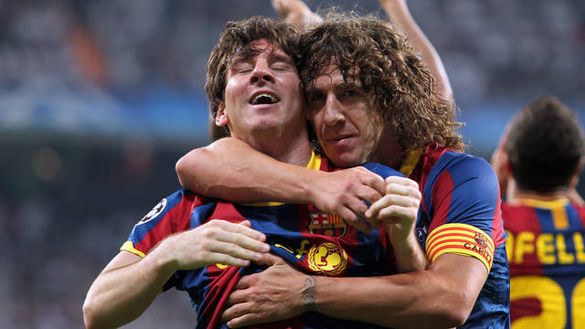 Puyol e Messi, Getty Images Puyol e Messi, Getty Images