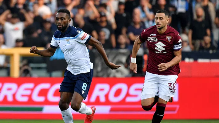 TURIN, ITALY - SEPTEMBER 23: Daniel Akpa Akrp of SS Lazio compete for the ball with Rolando Mandragora of Torino FC during the Serie A match between Torino FC v SS Lazio at Stadio Olimpico di Torino on September 23, 2021 in Turin, Italy. (Photo by Marco Rosi - SS Lazio/Getty Images)