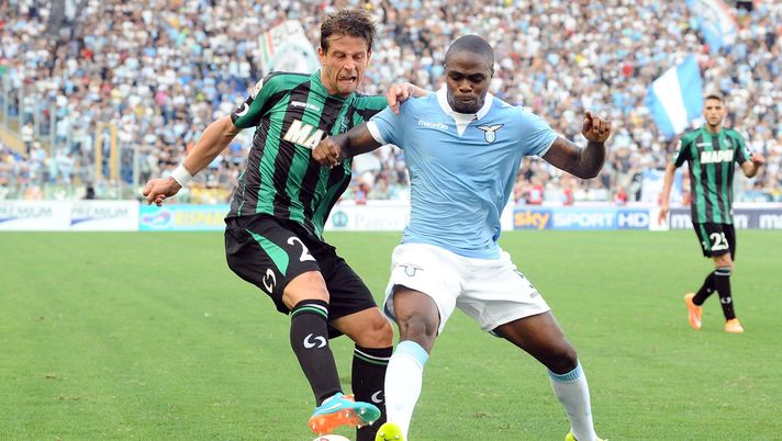 ROME, ITALY - OCTOBER 05: Marcello Gazzola # 23 of US Sassuolo Calcio ( L ) competes the ball with Edson Braafheid # 5 of SS Lazio ( R ) during the Serie A match between SS Lazio and US Sassuolo Calcio at Stadio Olimpico on October 5, 2014 in Rome, Italy. (Photo by Mario Carlini / Iguana Press/Getty Images) ROME, ITALY - OCTOBER 05: Marcello Gazzola # 23 of US Sassuolo Calcio ( L ) competes the ball with Edson Braafheid # 5 of SS Lazio ( R ) during the Serie A match between SS Lazio and US Sassuolo Calcio at Stadio Olimpico on October 5, 2014 in Rome, Italy. (Photo by Mario Carlini / Iguana Press/Getty Images)