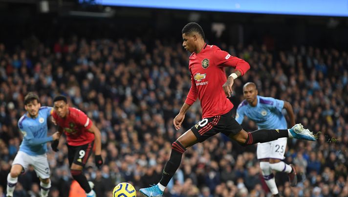 MANCHESTER, ENGLAND - DECEMBER 07: Marcus Rashford of Manchester United scores his team's first goal during the Premier League match between Manchester City and Manchester United at Etihad Stadium on December 07, 2019 in Manchester, United Kingdom. (Photo by Michael Regan/Getty Images) MANCHESTER, ENGLAND - DECEMBER 07: Marcus Rashford of Manchester United scores his team's first goal during the Premier League match between Manchester City and Manchester United at Etihad Stadium on December 07, 2019 in Manchester, United Kingdom. (Photo by Michael Regan/Getty Images)
