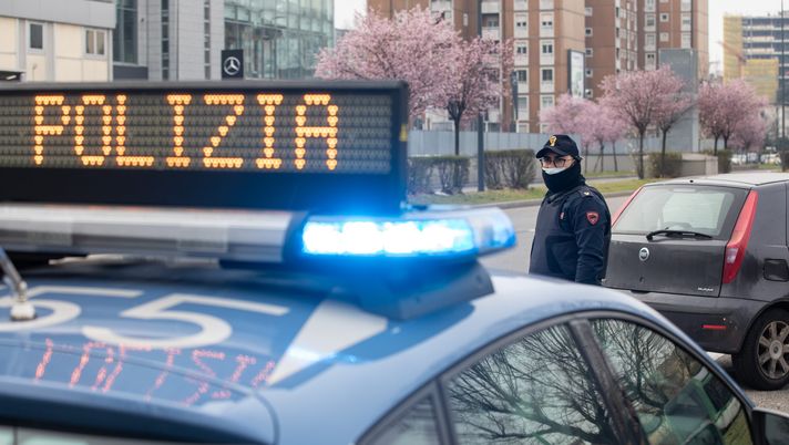 MILAN, ITALY - MARCH 10: An Italian State Police officer looks on at a checkpoint on March 10, 2020 in Milan, Italy. The Italian Government has taken the unprecedented measure of a nationwide lockdown, limiting people to move only for work or health reasons, in an effort to fight the world's second-most deadly coronavirus outbreak outside of China. (Photo by Emanuele Cremaschi/Getty Images) lucarelli