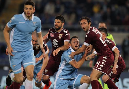 ROME, ITALY - MARCH 13: Stefan De Vrij (L) of SS Lazio competes for the ball with Emiliano Moretti of FC Torino during the Serie A match between SS Lazio and FC Torino at Stadio Olimpico on March 13, 2017 in Rome, Italy. (Photo by Paolo Bruno/Getty Images) ROME, ITALY - MARCH 13: Stefan De Vrij (L) of SS Lazio competes for the ball with Emiliano Moretti of FC Torino during the Serie A match between SS Lazio and FC Torino at Stadio Olimpico on March 13, 2017 in Rome, Italy. (Photo by Paolo Bruno/Getty Images)