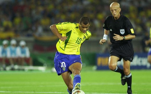 YOKOHAMA - JUNE 30: Rivaldo of Brazil is watched by referee Pierluigi Collina during the Germany v Brazil, World Cup Final match played at the International Stadium Yokohama, Yokohama, Japan on June 30, 2002. Brazil won 2-0. (Photo by Gary M. Prior/Getty Images) YOKOHAMA - JUNE 30: Rivaldo of Brazil is watched by referee Pierluigi Collina during the Germany v Brazil, World Cup Final match played at the International Stadium Yokohama, Yokohama, Japan on June 30, 2002. Brazil won 2-0. (Photo by Gary M. Prior/Getty Images)
