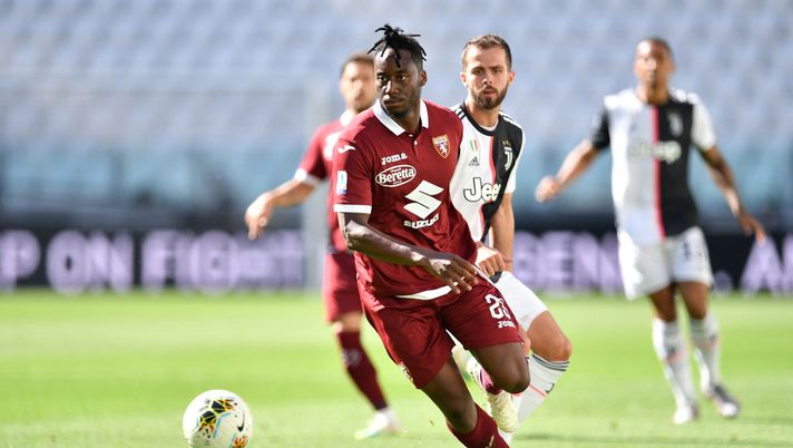 TURIN, ITALY - JULY 04:  Soualiho Meite of Torino FC in action against Miralem Pjanic of Juventus during the Serie A match between Juventus and Torino FC at Allianz Stadium on July 4, 2020 in Turin, Italy.  (Photo by Valerio Pennicino/Getty Images) 