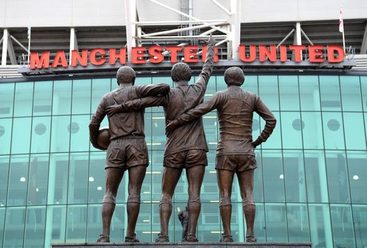 MANCHESTER, ENGLAND - SEPTEMBER 22: The United Trinity statue is seen outside the ground prior to the Premier League match between Manchester United and Wolverhampton Wanderers at Old Trafford on September 22, 2018 in Manchester, United Kingdom. (Photo by Ross Kinnaird/Getty Images) MANCHESTER, ENGLAND - SEPTEMBER 22: The United Trinity statue is seen outside the ground prior to the Premier League match between Manchester United and Wolverhampton Wanderers at Old Trafford on September 22, 2018 in Manchester, United Kingdom. (Photo by Ross Kinnaird/Getty Images)