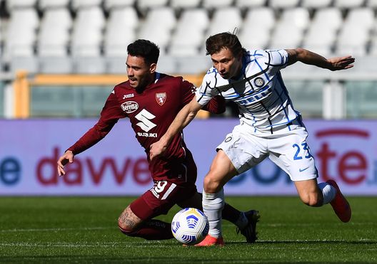 TURIN, ITALY - MARCH 14: Nicolo Barella of FC Internazionale competes for the ball with Nicolo Murru of Torino FC during the Serie A match between Torino FC and FC Internazionale at Stadio Olimpico di Torino on March 14, 2021 in Turin, Italy. Sporting stadiums around Italy remain under strict restrictions due to the Coronavirus Pandemic as Government social distancing laws prohibit fans inside venues resulting in games being played behind closed doors. (Photo by Claudio Villa - Inter/Getty Images) TURIN, ITALY - MARCH 14: Nicolo Barella of FC Internazionale competes for the ball with Nicolo Murru of Torino FC during the Serie A match between Torino FC and FC Internazionale at Stadio Olimpico di Torino on March 14, 2021 in Turin, Italy. Sporting stadiums around Italy remain under strict restrictions due to the Coronavirus Pandemic as Government social distancing laws prohibit fans inside venues resulting in games being played behind closed doors. (Photo by Claudio Villa - Inter/Getty Images)