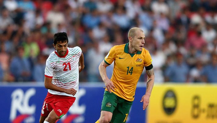 DUSHANBE, TAJIKISTAN - SEPTEMBER 08:  Aaron Mooy of Australia controls the ball as Manuchekhr Dzhalilov of Tajikistan closes in during the 2018 FIFA World Cup Qualifier match between the Australian Socceroos and Tajikistan at Central Republican Stadium on September 8, 2015 in Dushanbe, Tajikistan.  (Photo by Francois Nel/Getty Images) 