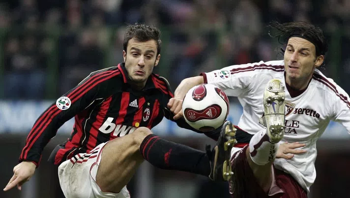 MILAN, ITALY ? DECEMBER 10: Alberto Gilardino of AC Milan competes with Gabriele Cioffi of Torino during the Serie A match between AC Milan and Torino at Giuseppe Meazza San Siro Stadium on December 10, 2006 in Milan, Italy. (Photo by Newpress/Getty Images)