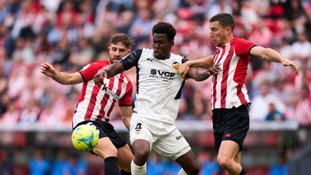 BILBAO, SPAIN - MAY 07: Yunus Musah of Valencia CF duels for the ball withn Oscar De Marcos of Athletic Club during the La Liga Santander match between Athletic Club and Valencia CF at San Mames Stadium on May 07, 2022 in Bilbao, Spain. (Photo by Juan Manuel Serrano Arce/Getty Images)