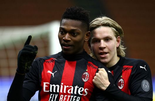 MILAN, ITALY - JANUARY 09: Rafael Leao of Milan celebrates with teammate Jens Petter Hauge after scoring their sides first goal during the Serie A match between AC Milan and Torino FC at Stadio Giuseppe Meazza on January 09, 2021 in Milan, Italy. Sporting stadiums around Italy remain under strict restrictions due to the Coronavirus Pandemic as Government social distancing laws prohibit fans inside venues resulting in games being played behind closed doors. (Photo by Marco Luzzani/Getty Images) 