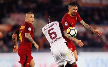  ROME, ITALY - MARCH 09: Aleksandar Kolarov of AS Roma competes for the ball with Afryie Acquah of Torino FC during the Serie A match between AS Roma and Torino FC at Stadio Olimpico on March 9, 2018 in Rome, Italy. (Photo by Paolo Bruno/Getty Images)