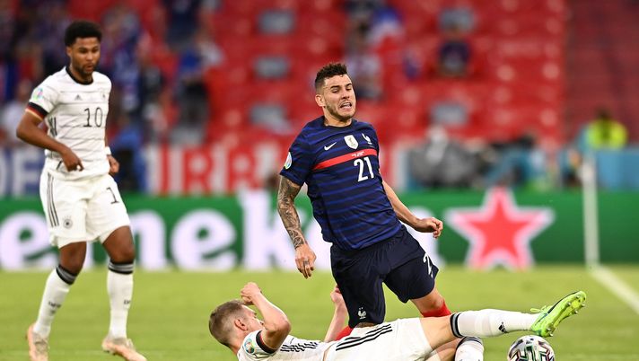 MUNICH, GERMANY - JUNE 15: Lucas Hernandez of France is challenged by Matthias Ginter of Germany during the UEFA Euro 2020 Championship Group F match between France and Germany at Football Arena Munich on June 15, 2021 in Munich, Germany. (Photo by Lukas Barth-Tuttas - Pool/Getty Images) MUNICH, GERMANY - JUNE 15: Lucas Hernandez of France is challenged by Matthias Ginter of Germany during the UEFA Euro 2020 Championship Group F match between France and Germany at Football Arena Munich on June 15, 2021 in Munich, Germany. (Photo by Lukas Barth-Tuttas - Pool/Getty Images)