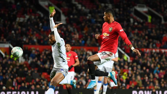 MANCHESTER, ENGLAND - DECEMBER 18: Marcus Rashford of Manchester United shoots and the ball hits Ryan Jackson of Colchester United which results in an own-goal and the second goal for Manchester United during the Carabao Cup Quarter Final match between Manchester United and Colchester United at Old Trafford on December 18, 2019 in Manchester, England. (Photo by Clive Mason/Getty Images) MANCHESTER, ENGLAND - DECEMBER 18: Marcus Rashford of Manchester United shoots and the ball hits Ryan Jackson of Colchester United which results in an own-goal and the second goal for Manchester United during the Carabao Cup Quarter Final match between Manchester United and Colchester United at Old Trafford on December 18, 2019 in Manchester, England. (Photo by Clive Mason/Getty Images)