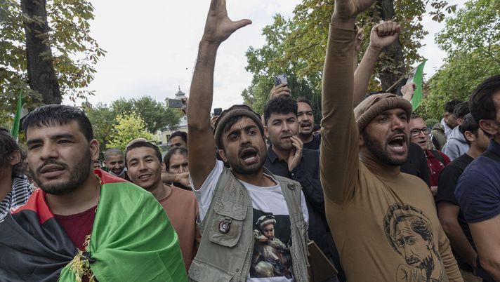 PARIS, FRANCE - SEPTEMBER 12: Men chant against the Taliban at a ceremony to mark the 20th anniversary of the death of Ahmad Shah Massoud, an Afghan politician, military leader and icon of resistance against the Taliban and Al Qaeda, on September 12, 2021 in Paris, France. Massoud was assassinated by two Al Qaeda suicide bombers posing as journalists on September 9, 2001, two days before the group undertook the infamous September 11 attacks on the New York World Trade Center. France had warm relationship with Massoud, hosting him April 2001, and naming a path after him in the Champs-Élysées park in Paris. Massoud was a powerful guerrilla commander during the resistance against the Soviet occupation of Afghanistan between 1979 and 1989. In the 1990s, he served as the defence minister for the Afghan government. After the Taliban's takeover in 1996 he was the leading opposition commander against their regime and their Al Qaeda allies until his assassination. His son Ahmad Massoud was until recently leading the last resistance to the Taliban as they retook control of Afghanistan following the withdrawal of US troops in August. (Photo by Sam Tarling/Getty Images) PARIS, FRANCE - SEPTEMBER 12: Men chant against the Taliban at a ceremony to mark the 20th anniversary of the death of Ahmad Shah Massoud, an Afghan politician, military leader and icon of resistance against the Taliban and Al Qaeda, on September 12, 2021 in Paris, France. Massoud was assassinated by two Al Qaeda suicide bombers posing as journalists on September 9, 2001, two days before the group undertook the infamous September 11 attacks on the New York World Trade Center. France had warm relationship with Massoud, hosting him April 2001, and naming a path after him in the Champs-Élysées park in Paris. Massoud was a powerful guerrilla commander during the resistance against the Soviet occupation of Afghanistan between 1979 and 1989. In the 1990s, he served as the defence minister for the Afghan government. After the Taliban's takeover in 1996 he was the leading opposition commander against their regime and their Al Qaeda allies until his assassination. His son Ahmad Massoud was until recently leading the last resistance to the Taliban as they retook control of Afghanistan following the withdrawal of US troops in August. (Photo by Sam Tarling/Getty Images)
