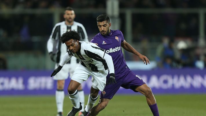 FLORENCE, ITALY - JANUARY 15: Maxi Olivera of ACF Fiorentina battles for the ball with Juan Cuadrado of Juventus FC during the Serie A match between ACF Fiorentina and Juventus FC at Stadio Artemio Franchi on January 15, 2017 in Florence, Italy. (Photo by Gabriele Maltinti/Getty Images) FLORENCE, ITALY - JANUARY 15: Maxi Olivera of ACF Fiorentina battles for the ball with Juan Cuadrado of Juventus FC during the Serie A match between ACF Fiorentina and Juventus FC at Stadio Artemio Franchi on January 15, 2017 in Florence, Italy. (Photo by Gabriele Maltinti/Getty Images)