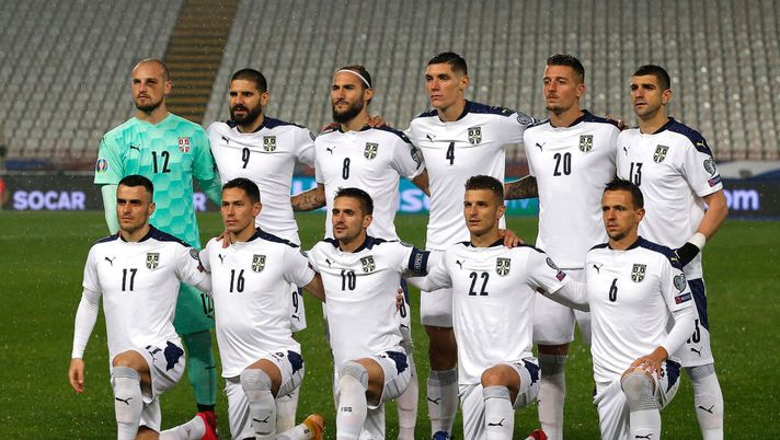 BELGRADE, SERBIA - NOVEMBER 12: The Serbia side line up for a team picture during the UEFA EURO 2020 Play-Off Final between Serbia and Scotland at Rajko Mitic Stadium on November 12, 2020 in Belgrade, Serbia. Football Stadiums around Europe remain empty due to the Coronavirus Pandemic as Government social distancing laws prohibit fans inside venues resulting in fixtures being played behind closed doors. (Photo by Srdjan Stevanovic/Getty Images) BELGRADE, SERBIA - NOVEMBER 12: The Serbia side line up for a team picture during the UEFA EURO 2020 Play-Off Final between Serbia and Scotland at Rajko Mitic Stadium on November 12, 2020 in Belgrade, Serbia. Football Stadiums around Europe remain empty due to the Coronavirus Pandemic as Government social distancing laws prohibit fans inside venues resulting in fixtures being played behind closed doors. (Photo by Srdjan Stevanovic/Getty Images)