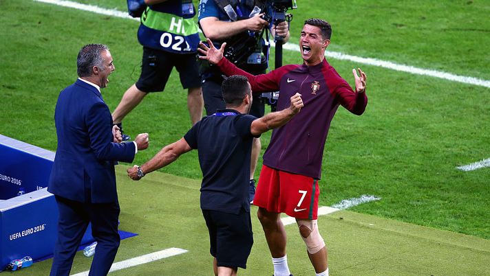 PARIS, FRANCE - JULY 10:  Cristiano Ronaldo of Portugal celebrates with his team staffs after winning the tournament after the UEFA EURO 2016 Final match between Portugal and France at Stade de France on July 10, 2016 in Paris, France.  (Photo by Alex Livesey/Getty Images) 