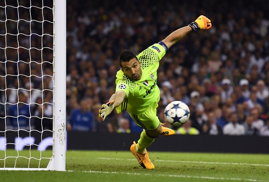  CARDIFF, WALES - JUNE 03: Gianluigi Buffon of Juventus dives but fails to stop Casemiro of Real Madrid (not pictured) shot from going in for Real Madrid second goal during the UEFA Champions League Final between Juventus and Real Madrid at National Stadium of Wales on June 3, 2017 in Cardiff, Wales.  (Photo by Laurence Griffiths/Getty Images) 