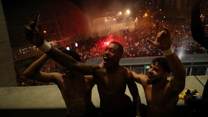 PARIS, FRANCE - MARCH 11: (FREE FOR EDITORIAL USE) In this handout image provided by UEFA, Presnel Kimpembe and Juan Bernat of Paris Saint-Germain celebrate victory after the UEFA Champions League round of 16 second leg match between Paris Saint-Germain and Borussia Dortmund at Parc des Princes on March 11, 2020 in Paris, France. The match is played behind closed doors as a precaution against the spread of COVID-19 (Coronavirus).  (Photo by UEFA - Handout/UEFA via Getty Images) 