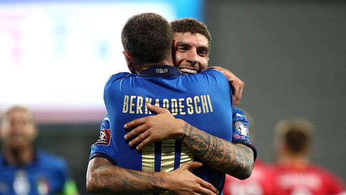 REGGIO NELL'EMILIA, ITALY - SEPTEMBER 08: Giovanni Di Lorenzo of Italy celebrates with Federico Bernardeschi after scoring their side's fifth goal during the 2022 FIFA World Cup Qualifier match between Italy and Lithuania at Mapei Stadium - Citta' del Tricolore on September 08, 2021 in Reggio nell'Emilia, Italy. (Photo by Marco Luzzani/Getty Images) REGGIO NELL'EMILIA, ITALY - SEPTEMBER 08: Giovanni Di Lorenzo of Italy celebrates with Federico Bernardeschi after scoring their side's fifth goal during the 2022 FIFA World Cup Qualifier match between Italy and Lithuania at Mapei Stadium - Citta' del Tricolore on September 08, 2021 in Reggio nell'Emilia, Italy. (Photo by Marco Luzzani/Getty Images)