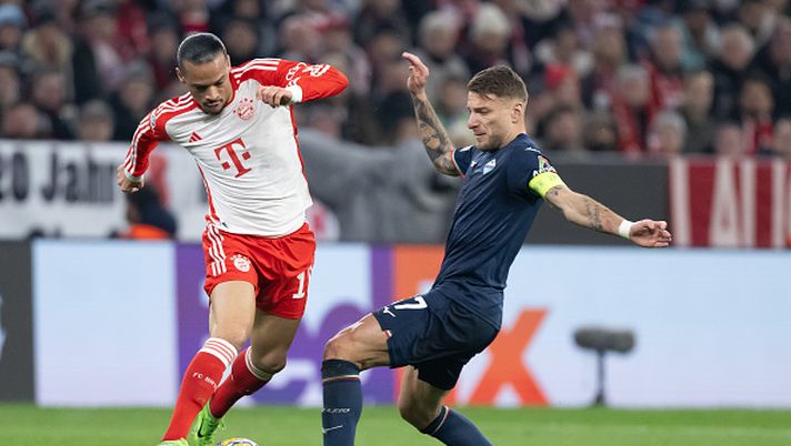 MUNICH, GERMANY - MARCH 05: Leroy Sane of FC Bayern München is tackled by Ciro Immobile of SS Lazio during the UEFA Champions League 2023/24 round of 16 second leg match between FC Bayern München and SS Lazio at Allianz Arena on March 05, 2024 in Munich, Germany. (Photo by Christian Kaspar-Bartke/Getty Images) Ognuno al suo posto - immagine 1
