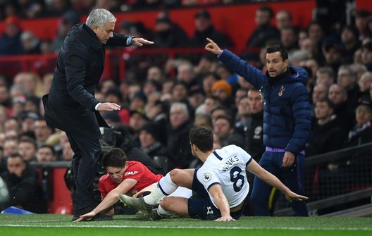 MANCHESTER, ENGLAND - DECEMBER 04: Daniel James of Manchester United collides into Jose Mourinho, Manager of Tottenham Hotspur as he is tackled by Harry Winks of Tottenham Hotspur during the Premier League match between Manchester United and Tottenham Hotspur at Old Trafford on December 04, 2019 in Manchester, United Kingdom. (Photo by Stu Forster/Getty Images) MANCHESTER, ENGLAND - DECEMBER 04: Daniel James of Manchester United collides into Jose Mourinho, Manager of Tottenham Hotspur as he is tackled by Harry Winks of Tottenham Hotspur during the Premier League match between Manchester United and Tottenham Hotspur at Old Trafford on December 04, 2019 in Manchester, United Kingdom. (Photo by Stu Forster/Getty Images)