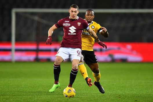  TURIN, ITALY - DECEMBER 12: Andrea Belotti of Torino F.C. is put under pressure by Samir of Udinese Calcio during the Serie A match between Torino FC and Udinese Calcio at Stadio Olimpico di Torino on December 12, 2020 in Turin, Italy. Sporting stadiums around Italy remain under strict restrictions due to the Coronavirus Pandemic as Government social distancing laws prohibit fans inside venues resulting in games being played behind closed doors. (Photo by Valerio Pennicino/Getty Images) 