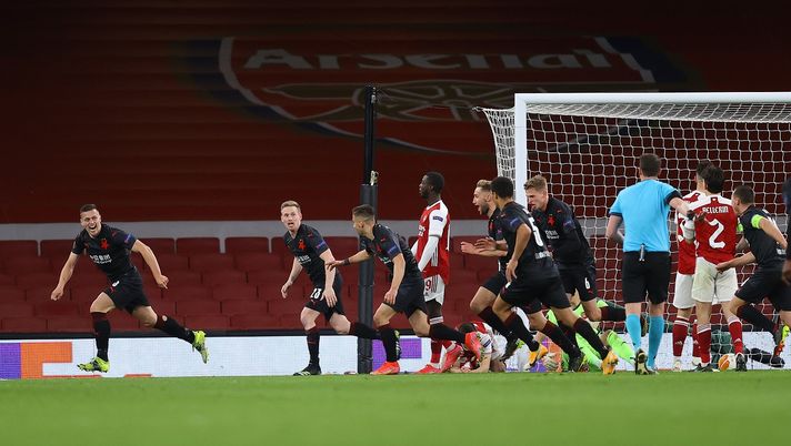 LONDON, ENGLAND - APRIL 08: Tomas Holes of Slavia Praha celebrates with team mates after scoring their side's first goal during the UEFA Europa League Quarter Final First Leg match between Arsenal FC and Slavia Praha at Emirates Stadium on April 08, 2021 in London, England. Sporting stadiums around Europe remain under strict restrictions due to the Coronavirus Pandemic as Government social distancing laws prohibit fans inside venues resulting in games being played behind closed doors. (Photo by Julian Finney/Getty Images) LONDON, ENGLAND - APRIL 08: Tomas Holes of Slavia Praha celebrates with team mates after scoring their side's first goal during the UEFA Europa League Quarter Final First Leg match between Arsenal FC and Slavia Praha at Emirates Stadium on April 08, 2021 in London, England. Sporting stadiums around Europe remain under strict restrictions due to the Coronavirus Pandemic as Government social distancing laws prohibit fans inside venues resulting in games being played behind closed doors. (Photo by Julian Finney/Getty Images)