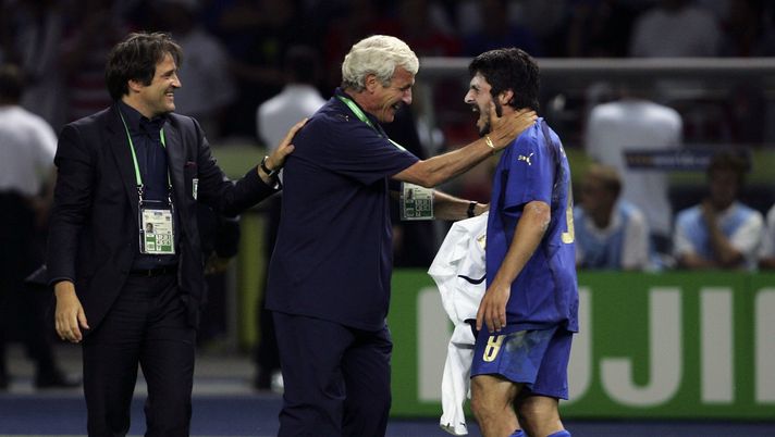 BERLIN - JULY 9: Gennaro Gattuso (R) of Italy is congratulated by Marcello Lippi (C), the coach of Italy, following their team's victory during the FIFA World Cup Germany 2006 Final match between Italy and France at the Olympic Stadium on July 9, 2006 in Berlin, Germany. (Photo by Alex Livesey/Getty Images) BERLIN - JULY 9: Gennaro Gattuso (R) of Italy is congratulated by Marcello Lippi (C), the coach of Italy, following their team's victory during the FIFA World Cup Germany 2006 Final match between Italy and France at the Olympic Stadium on July 9, 2006 in Berlin, Germany. (Photo by Alex Livesey/Getty Images)