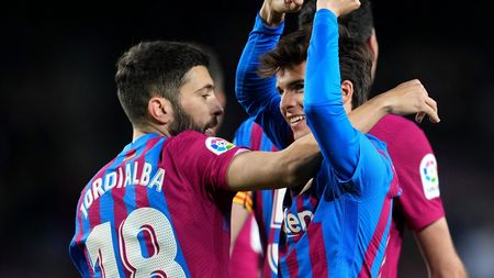 BARCELONA, SPAIN - MARCH 13: Riqui Puig of FC Barcelona celebrates with teammate Jordi Alba after scoring their team's fourth goal during the LaLiga Santander match between FC Barcelona and CA Osasuna at Camp Nou on March 13, 2022 in Barcelona, Spain. (Photo by Alex Caparros/Getty Images)