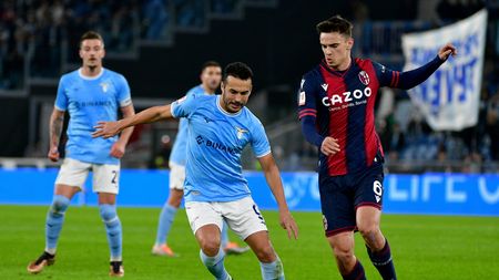ROME, ITALY - JANUARY 19: Pedro Rodriguez of SS Lazio compete for the ball with Nikola Moro of Bologna FC during the coppa Italia match between SS Lazio v Bologna FC at Olimpico Stadium on January 19, 2023 in Rome, Italy. (Photo by Marco Rosi - SS Lazio/Getty Images)